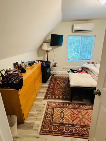 a living room with furniture and a rug