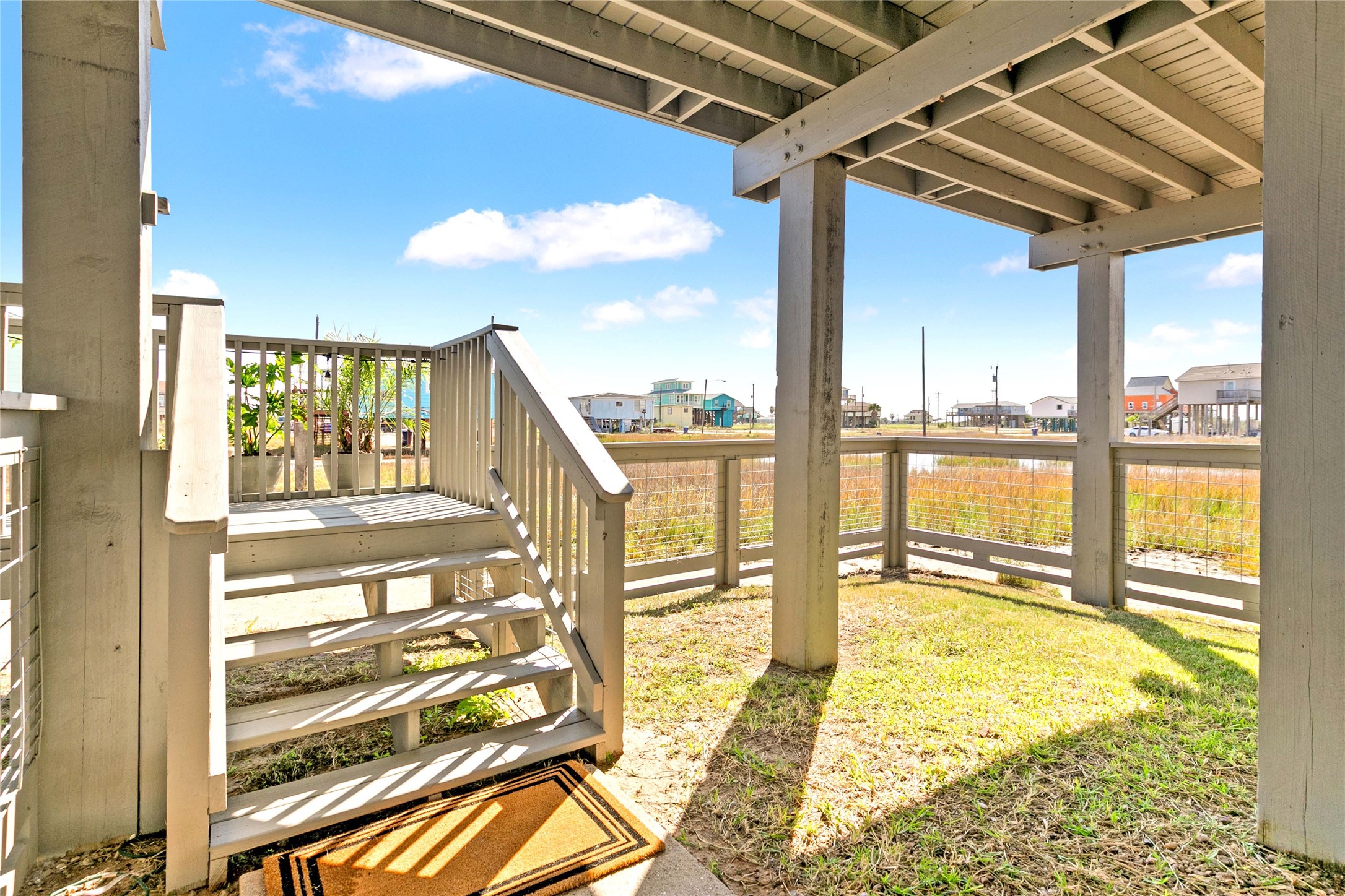 715 Caisson Street Surfside Beach, TX 77541 - Photo 19 of 35 Stairs go down into a small fenced area perfect for pets. Gate at the top of the stairs as well.