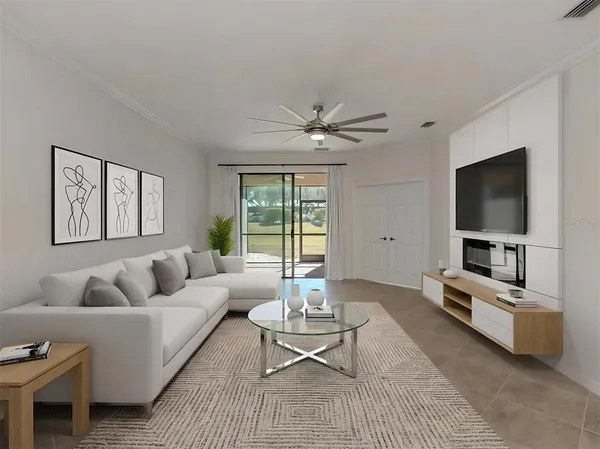 a living room with furniture and a flat screen tv