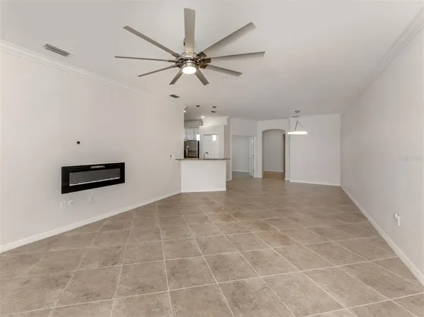 a view of a kitchen with an empty space and a window