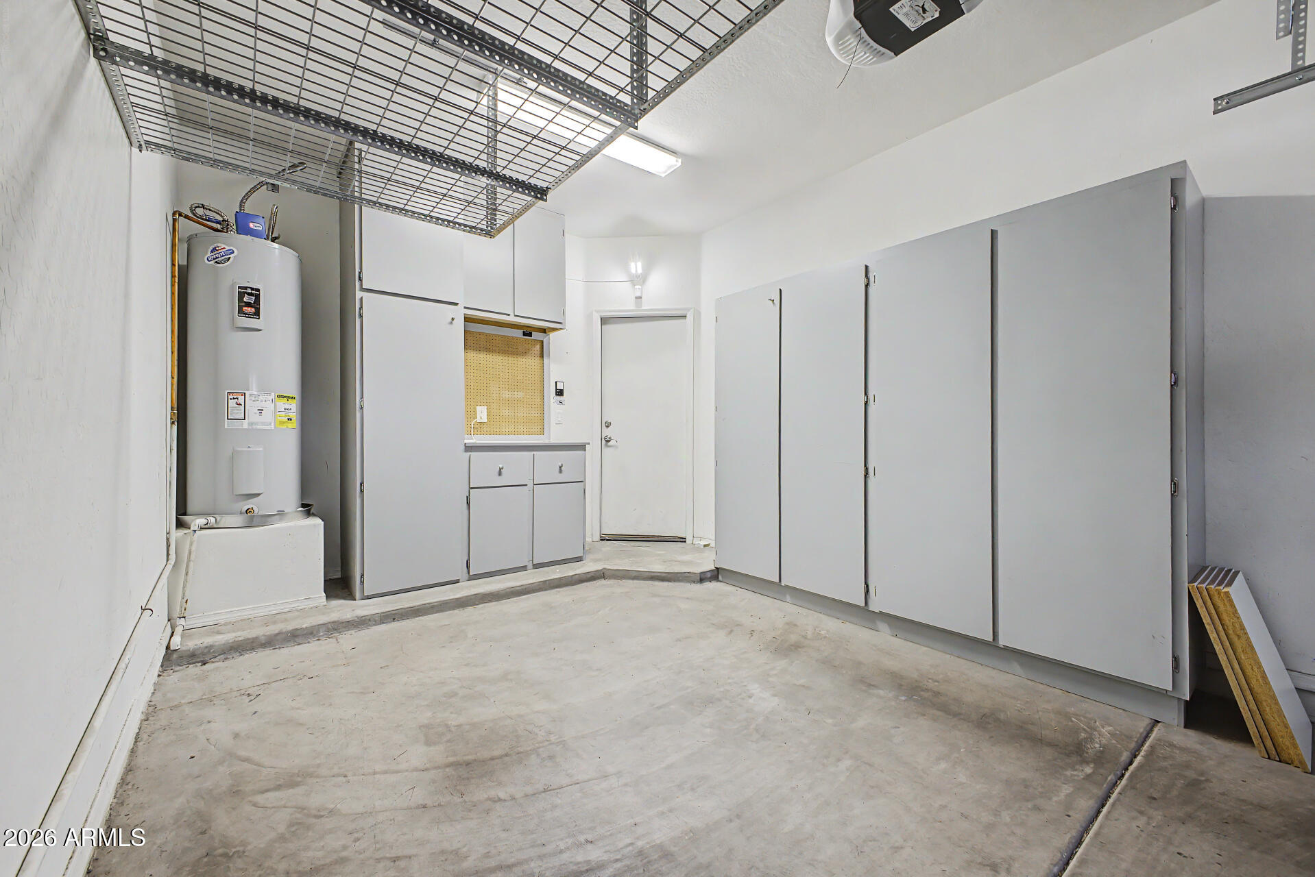 2600 East Springfield Place, Unit 109 Chandler, AZ 85286 - Photo 24 of 38 a view of a storage & utility room with closet dryer and washer