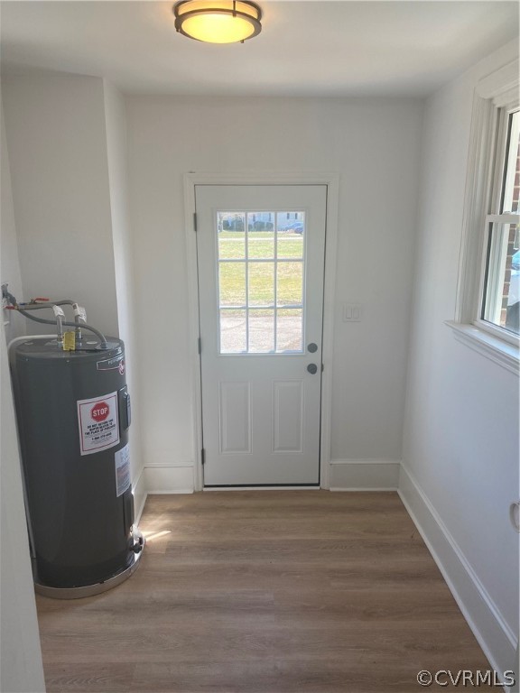 13462 Cabin Point Road Stony Creek, VA 23882 - Photo 11 of 30 an empty room with wooden floor and windows