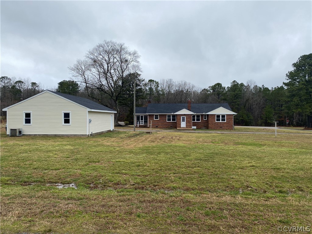 13462 Cabin Point Road Stony Creek, VA 23882 - Photo 30 of 30 a front view of house with yard and trees in the background