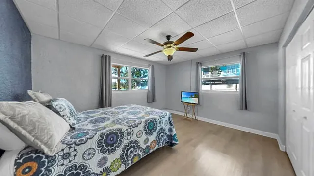 a view of a hallway with wooden floor and entryway