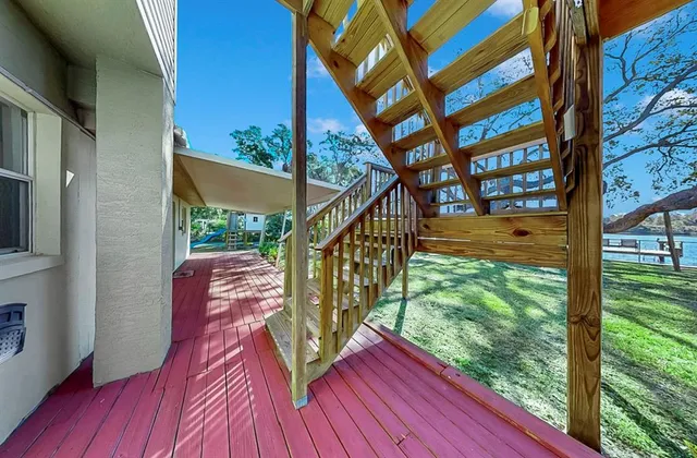 a view of living room with furniture and wooden floor