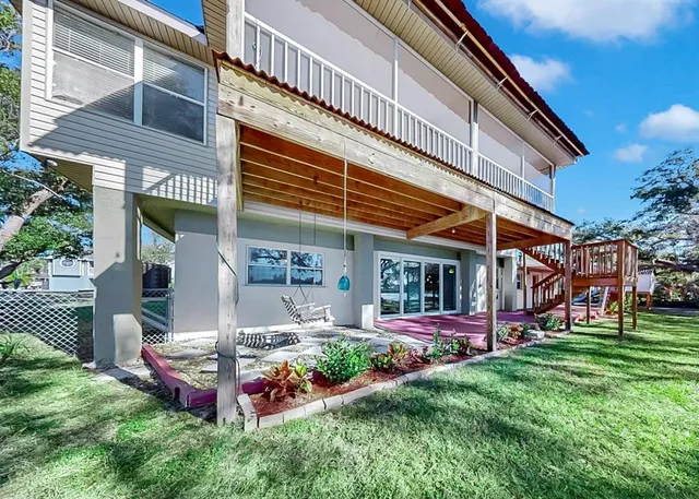 a kitchen with stainless steel appliances granite countertop a stove and a wooden floors