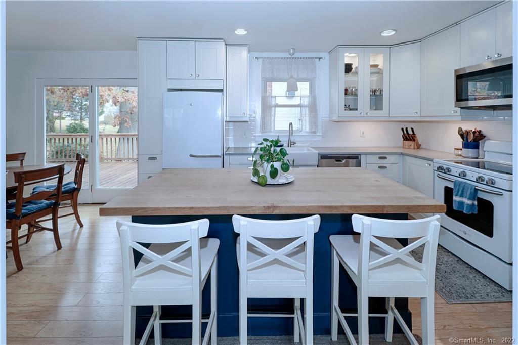 This delightful updated kitchen opens to the dining area and family room