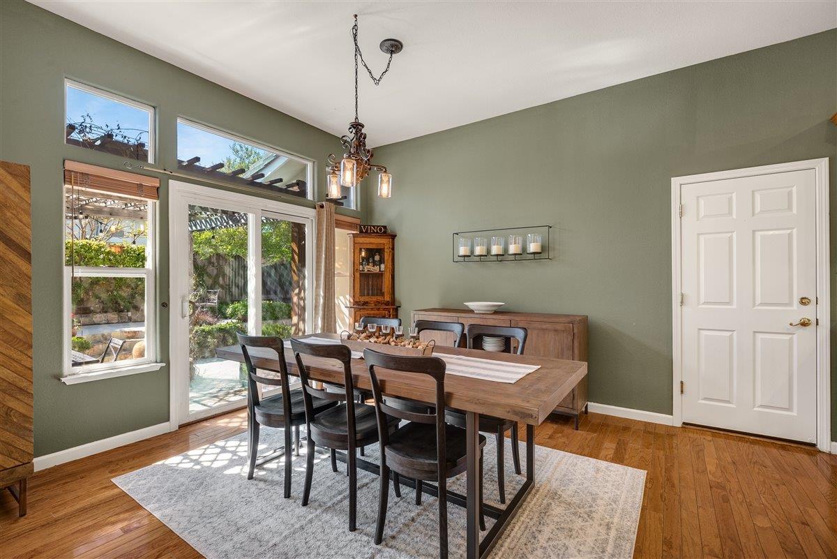 1416 Casablanca Circle Gilroy, CA 95020 - Photo 14 of 32 a view of a dining room with furniture window and wooden floor