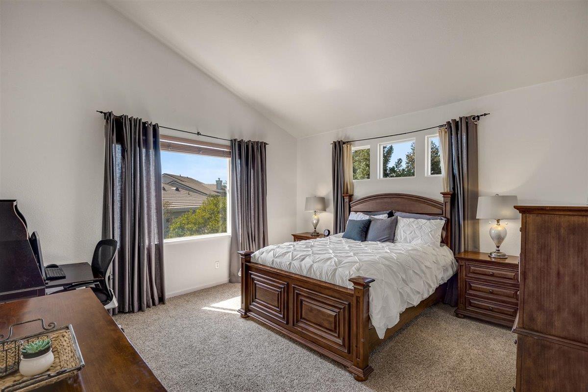 1416 Casablanca Circle Gilroy, CA 95020 - Photo 16 of 32 a bed sitting in a bedroom next to a window