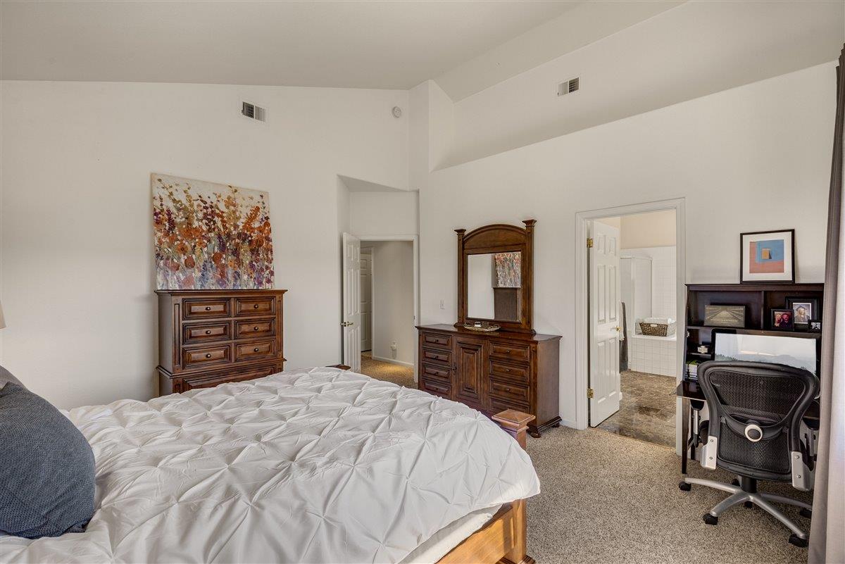 1416 Casablanca Circle Gilroy, CA 95020 - Photo 17 of 32 a bedroom with a bed and furniture