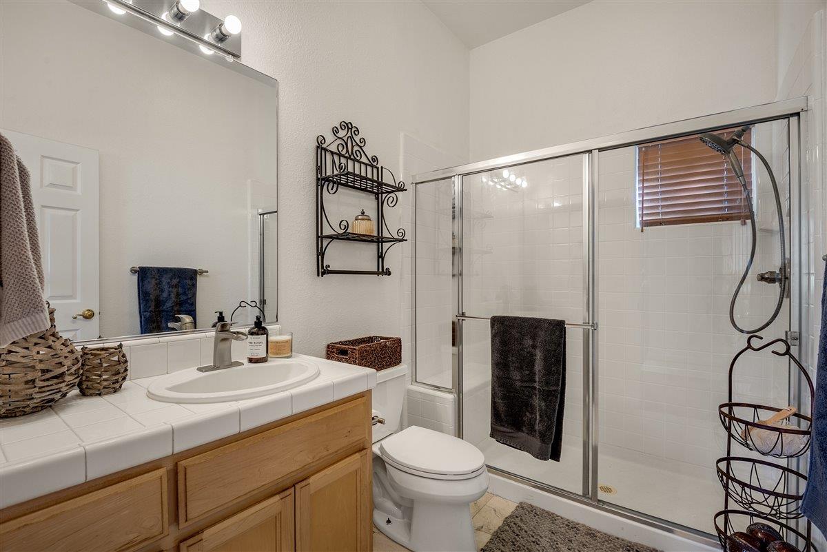 1416 Casablanca Circle Gilroy, CA 95020 - Photo 25 of 32 a bathroom with a sink toilet and shower