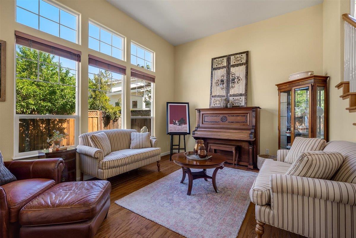 1416 Casablanca Circle Gilroy, CA 95020 - Photo 3 of 32 a living room with furniture a table and a large window