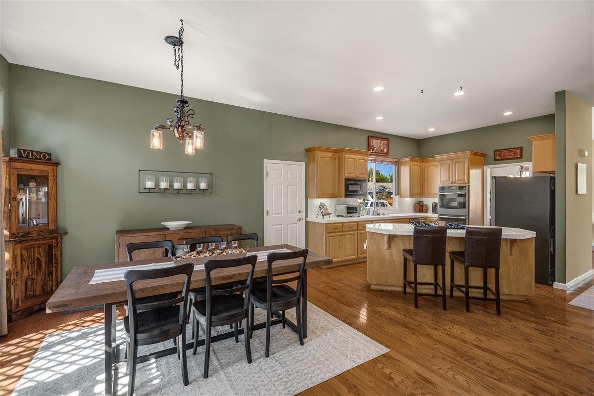 1416 Casablanca Circle Gilroy, CA 95020 - Photo 6 of 32 a view of a dining room with furniture window and wooden floor