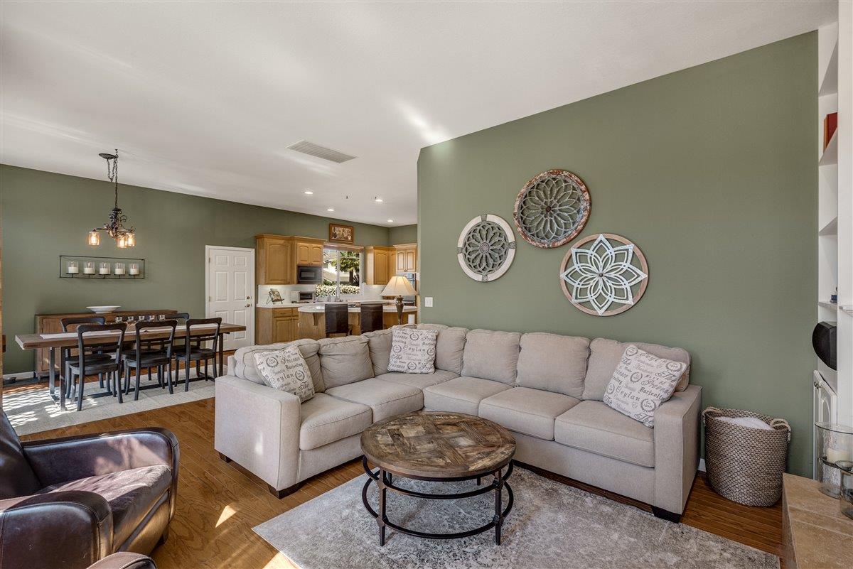 1416 Casablanca Circle Gilroy, CA 95020 - Photo 9 of 32 a living room with furniture and a large mirror