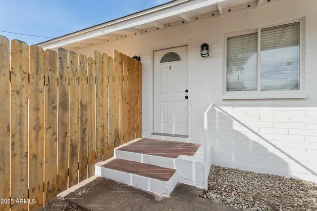 an aerial view of a house with a swimming pool