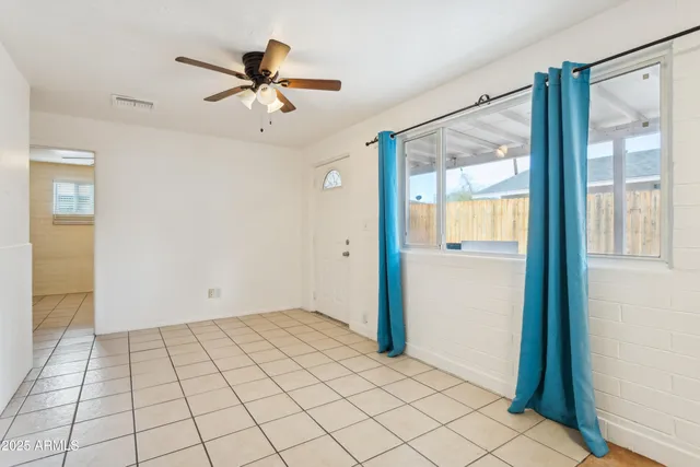 an aerial view of a house with yard