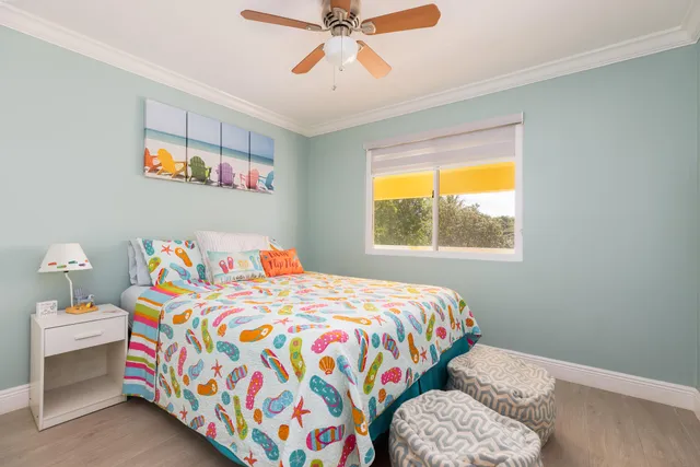 a bedroom with a bed and a tv