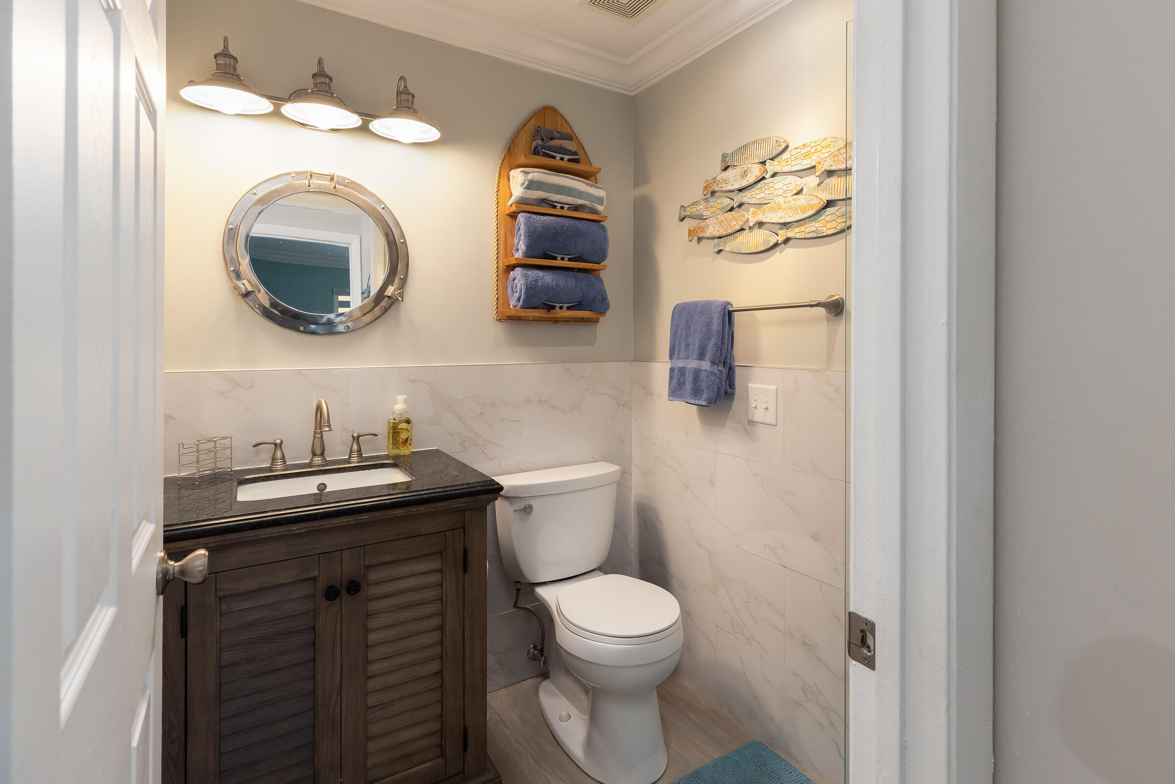 98222 Windward Avenue Key Largo, FL 33037 - Photo 36 of 41 a bathroom with a toilet and a sink