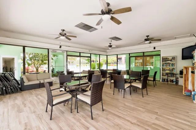 a view of a swimming pools under an umbrella