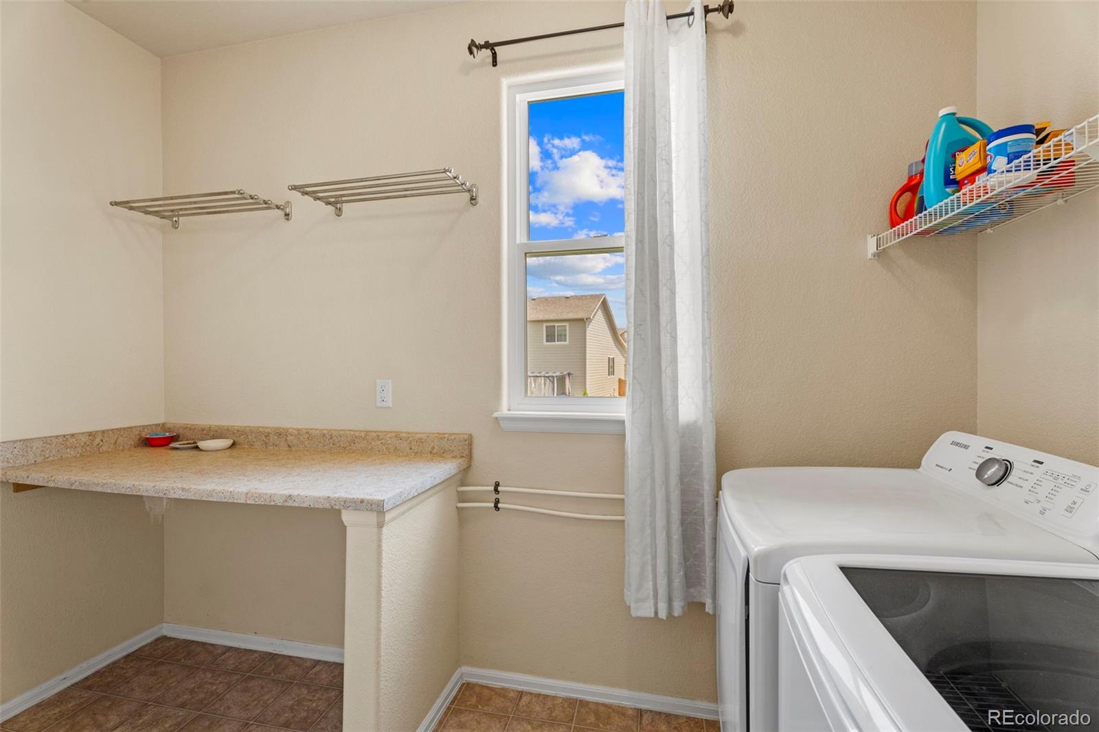 4651 Dancing Rain Way Colorado Springs, CO 80911 - Photo 11 of 32 a utility room with dryer and washer