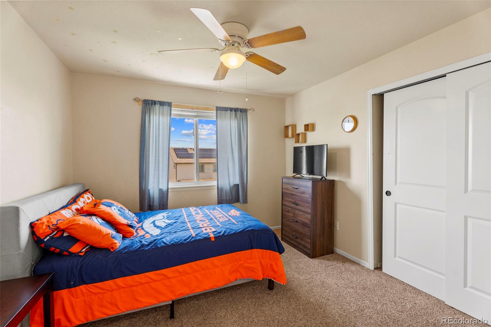 4651 Dancing Rain Way Colorado Springs, CO 80911 - Photo 16 of 32 a bedroom with a bed and a window