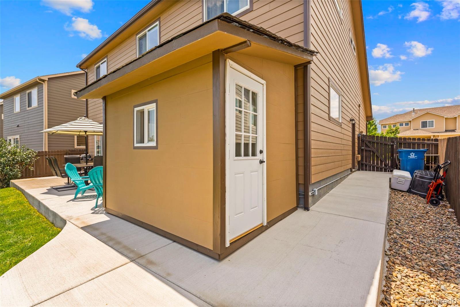4651 Dancing Rain Way Colorado Springs, CO 80911 - Photo 25 of 32 a view of a house with backyard and sitting area