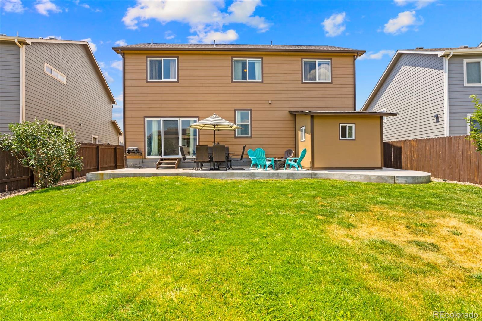 4651 Dancing Rain Way Colorado Springs, CO 80911 - Photo 26 of 32 a front view of house with yard and trees in the background