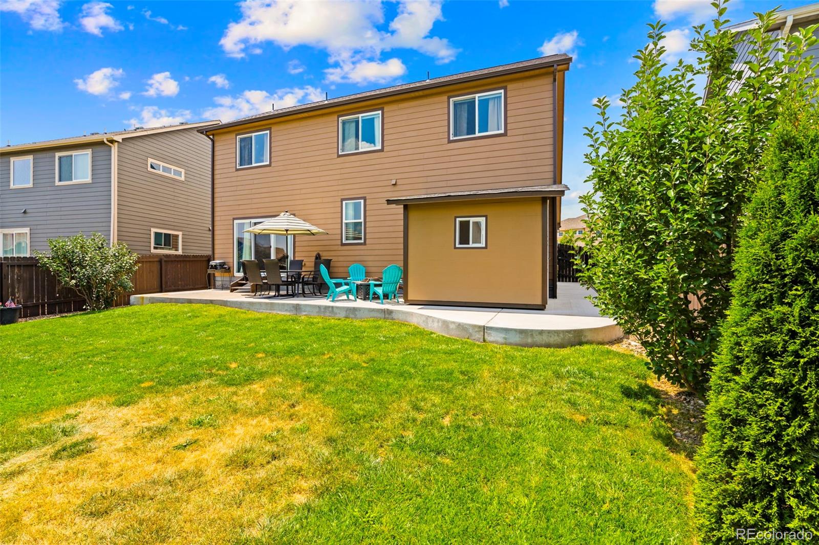 4651 Dancing Rain Way Colorado Springs, CO 80911 - Photo 27 of 32 a front view of house with yard and outdoor seating
