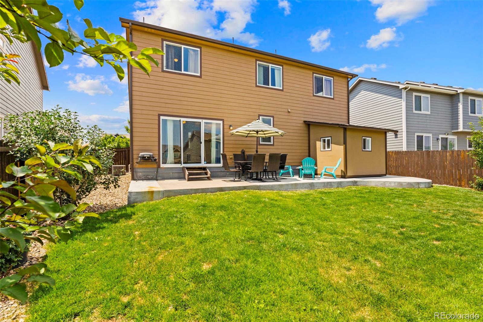 4651 Dancing Rain Way Colorado Springs, CO 80911 - Photo 28 of 32 a front view of house with yard