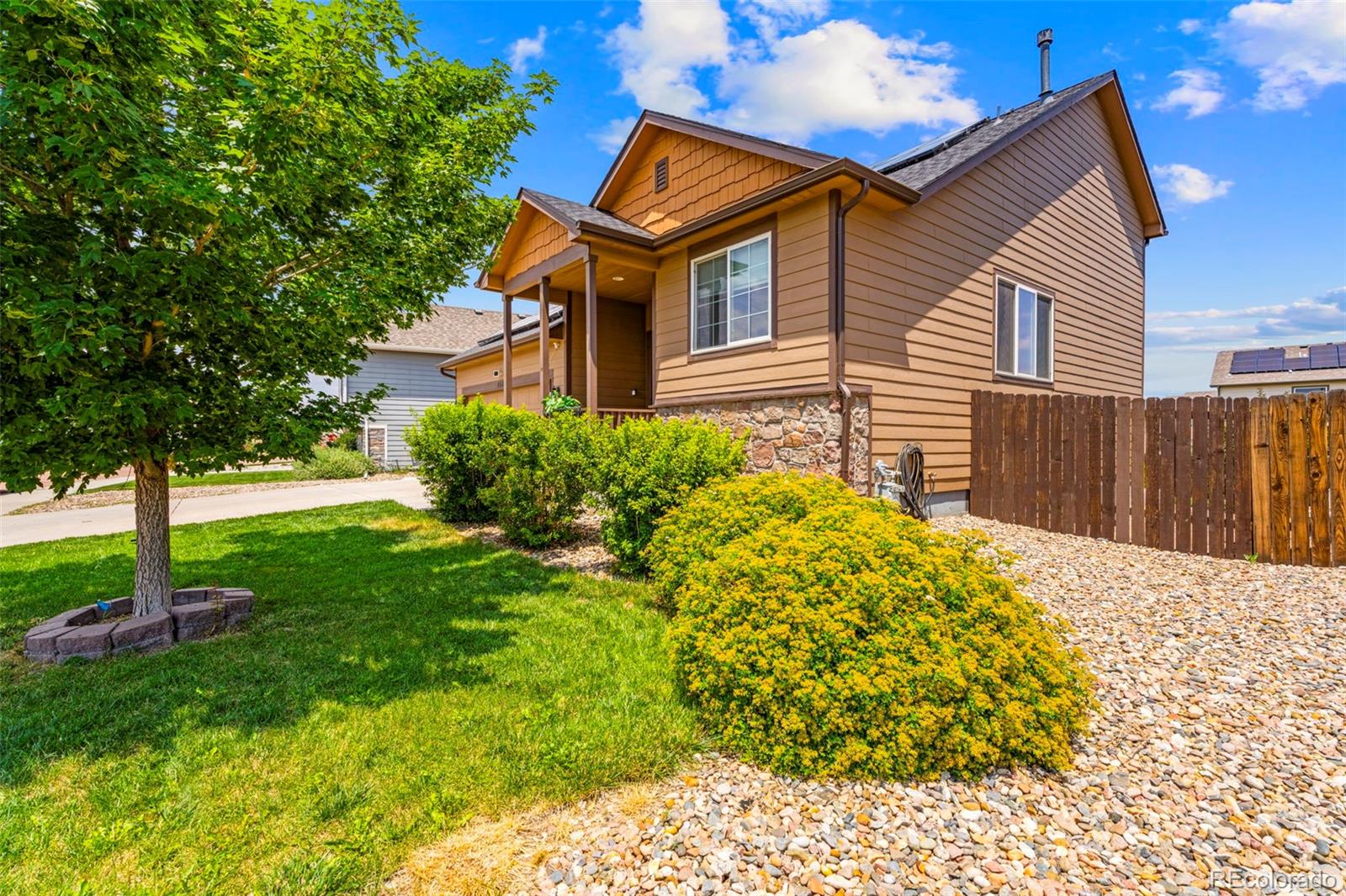 4651 Dancing Rain Way Colorado Springs, CO 80911 - Photo 3 of 32 a front view of a house with garden