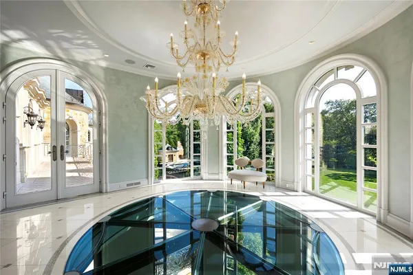 a bathroom with a tub sink and mirror