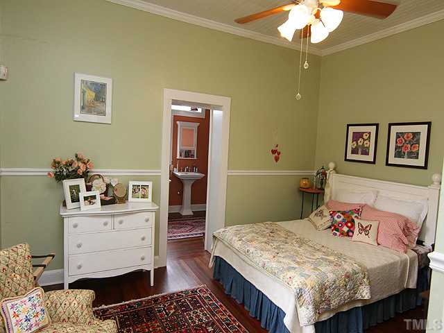 3511 Carpenter Pond Road Durham, NC 27703 - Photo 13 of 25 Wonderful Guest Bedroom with Hardwood Flooring-Inviting Wall Color-Ceiling Fan