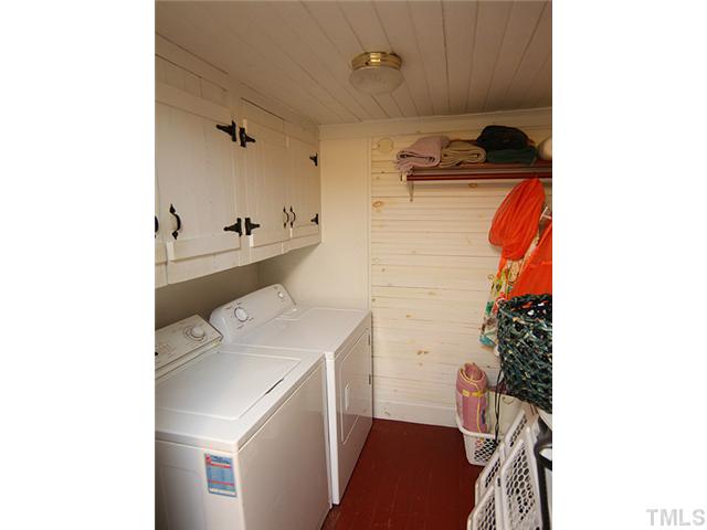3511 Carpenter Pond Road Durham, NC 27703 - Photo 17 of 25 Laundry Room with Good Storage Space - Cabinets Over Washer/Dryer
