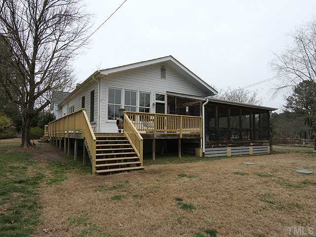 3511 Carpenter Pond Road Durham, NC 27703 - Photo 20 of 25 Deck Wraps to Side Door Entrance-Screen Porch Wraps from Side Entry to Back. Exterior Just Can Not Capture the Spacious Home Interior!