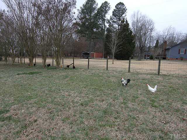 3511 Carpenter Pond Road Durham, NC 27703 - Photo 23 of 25 Two Acres of Private Serene Land. Fenced Pasture Area with Pond. Separate Area Outside of Deck & Screen Porch. Enjoy the Country but Convenience iof Shopping is Just Minutes Away!