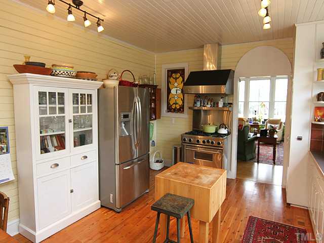 3511 Carpenter Pond Road Durham, NC 27703 - Photo 7 of 25 Notice the Unique Bead Board Wall and Ceiling. Spacious Work Area For Cooking & Gathering! Wolf Gas Range with Vent Hood & Spice Holder For Preparing Those Delicious Meals.