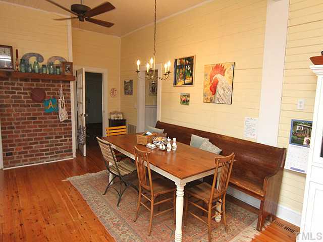 3511 Carpenter Pond Road Durham, NC 27703 - Photo 8 of 25 Comfortable-Relaxing and Ready to Enjoy Those Country Meals! Spacious Dining Area with Bead Board Walls-Harwoods and Brick Accent.