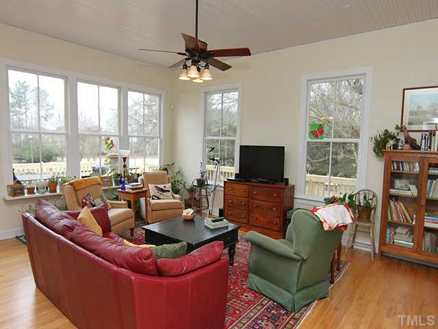 3511 Carpenter Pond Road Durham, NC 27703 - Photo 9 of 25 Light & Bright Filled New Addition Family Room! Spacious But Warm Filled with Hardwood Floors and Numerous Windows to Enjoy the Private Nature Outside.