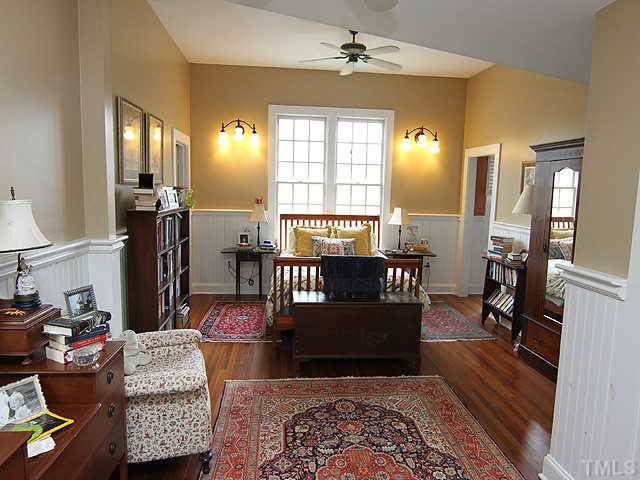 3511 Carpenter Pond Road Durham, NC 27703 - Photo 10 of 25 Wonderful Master Bedroom. Enjoy the Sitting Area Space in the Master Bedroom. Rich Hardwood Floors-Bead Board Wainscoat- Custom Light Fixtures.