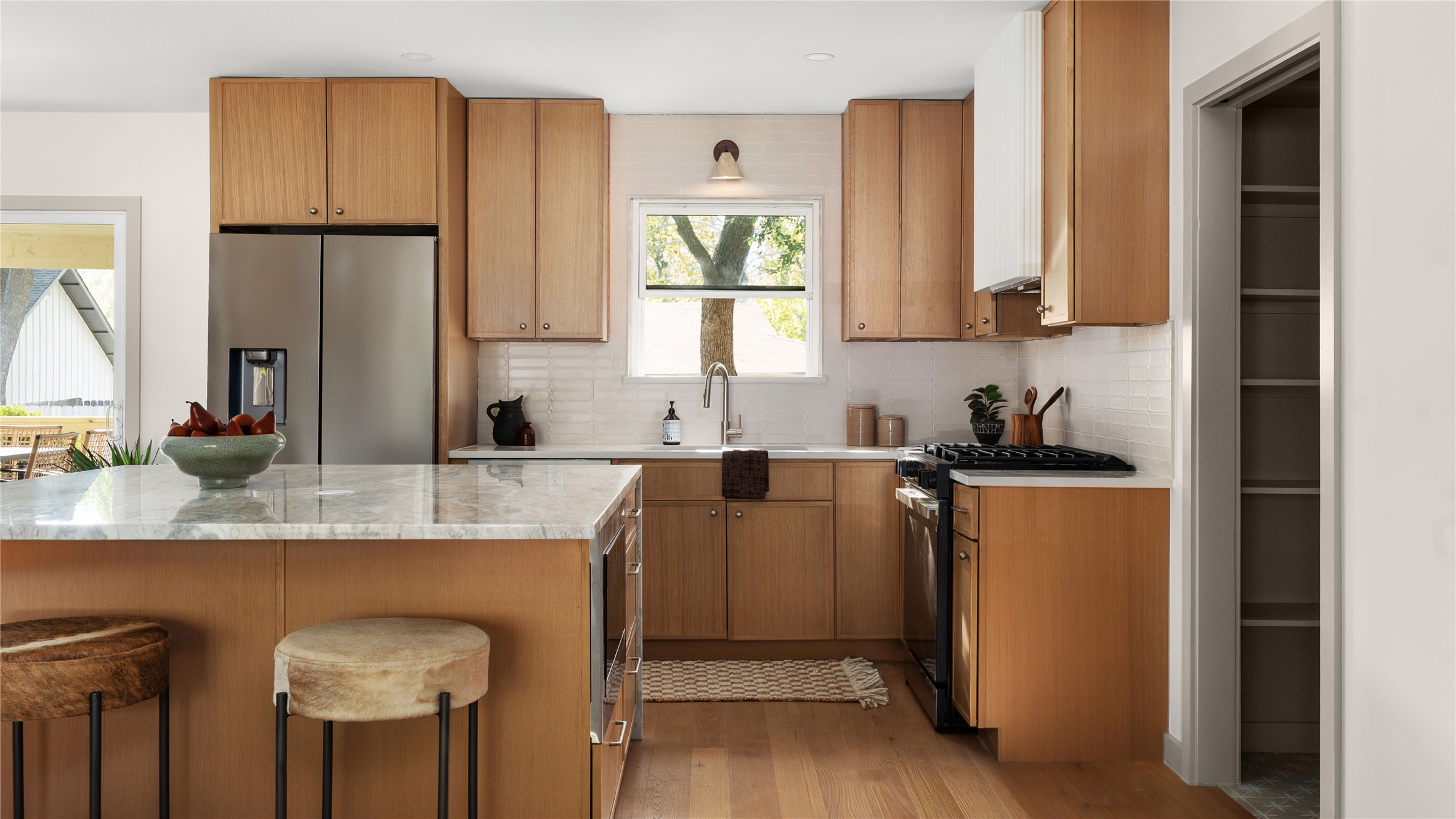 a kitchen with stainless steel appliances granite countertop a refrigerator sink and cabinets
