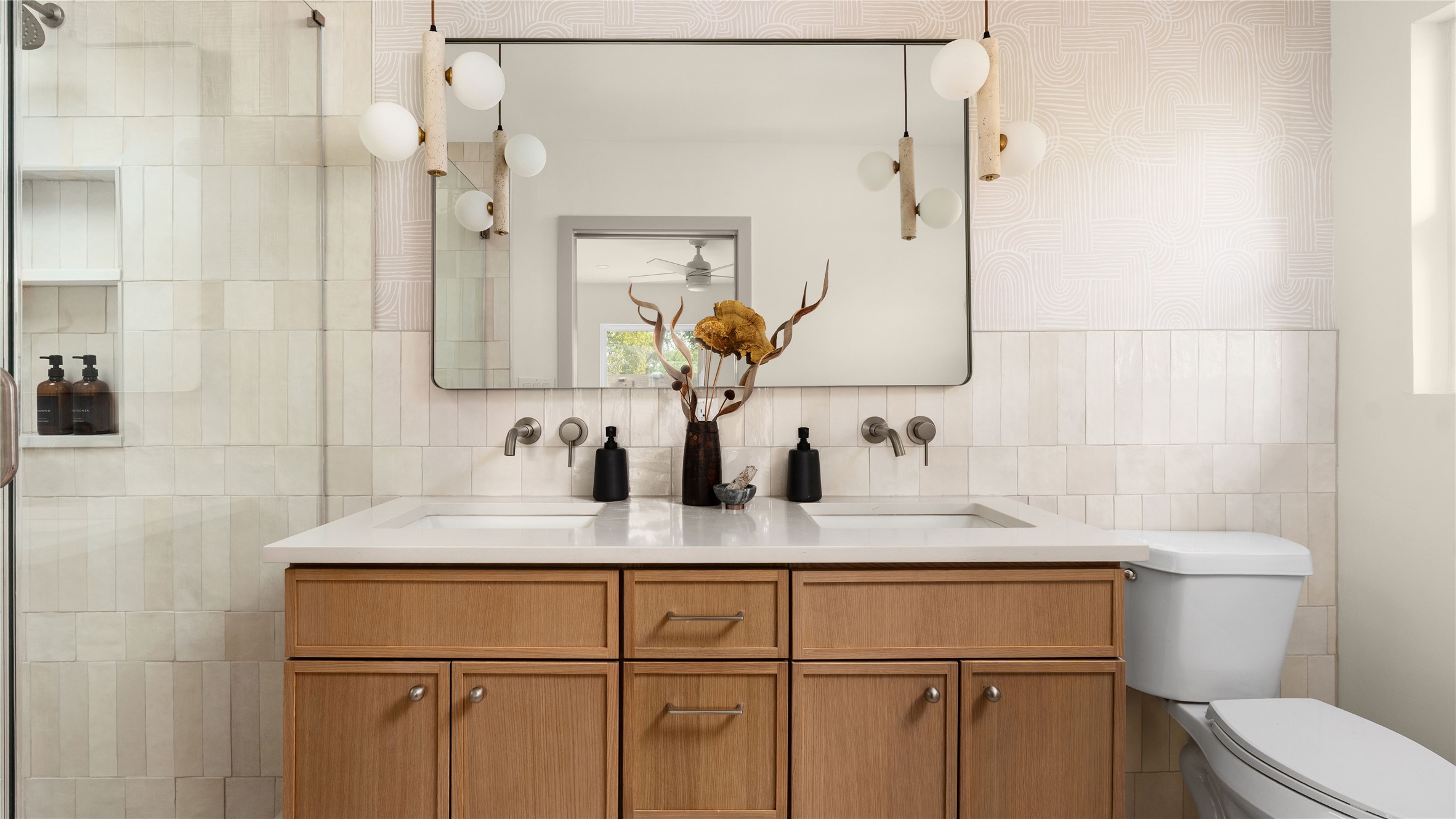 5504 Mapleleaf Drive Austin, TX 78723 - Photo 15 of 23 a bathroom with a granite countertop sink a toilet and a mirror