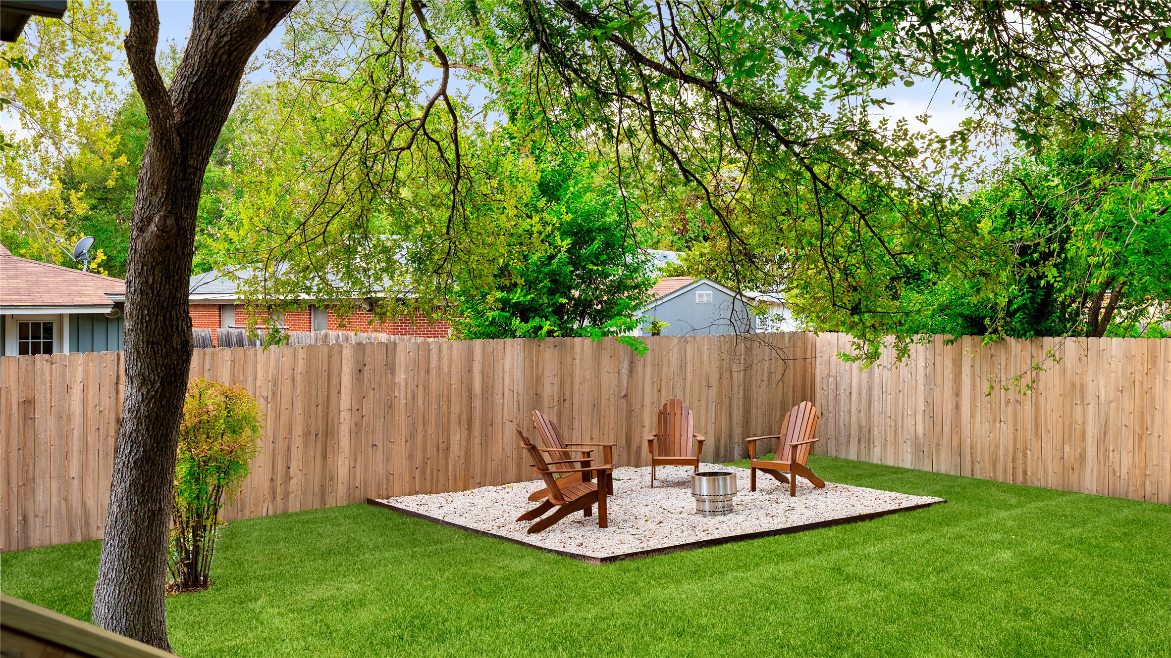5504 Mapleleaf Drive Austin, TX 78723 - Photo 21 of 23 a view of backyard with table and chairs and wooden fence