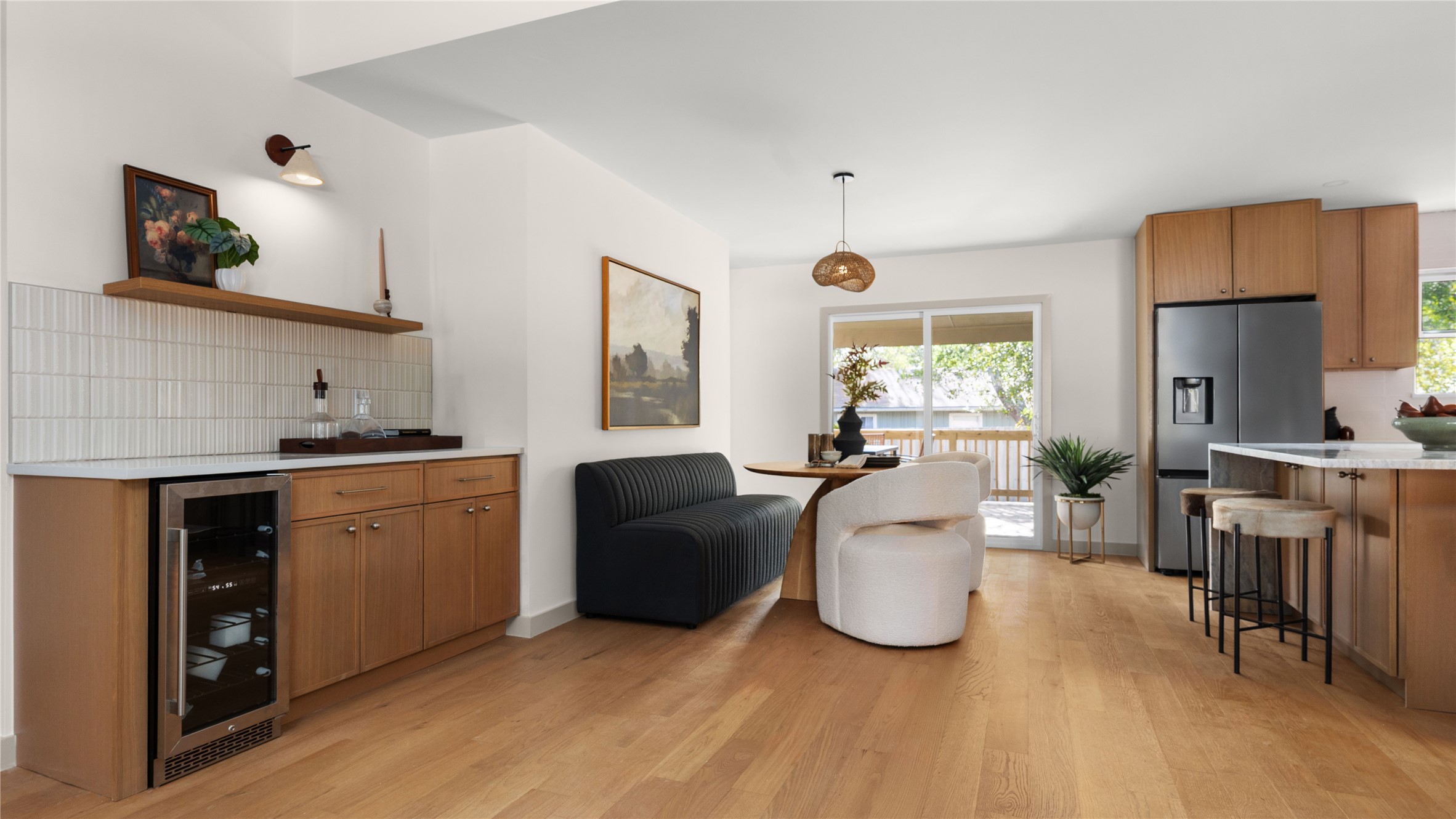 5504 Mapleleaf Drive Austin, TX 78723 - Photo 9 of 23 a living room with furniture a dining table and kitchen view