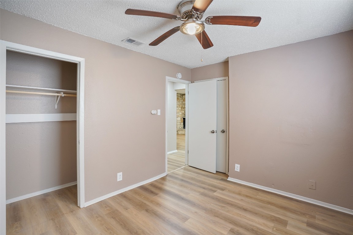 2312 Rachael Court, Unit C Austin, TX 78748 - Photo 11 of 13 an empty room with closet and a ceiling fan