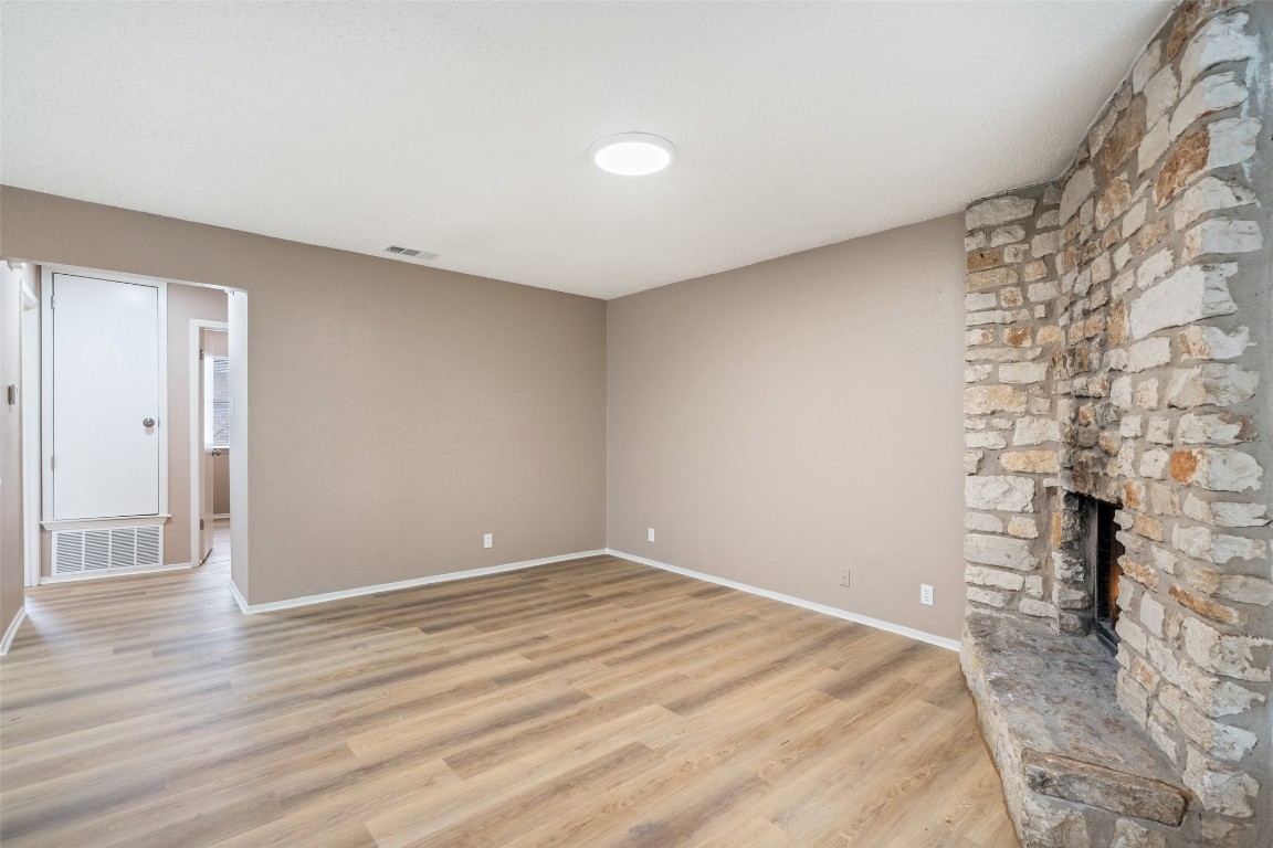 2312 Rachael Court, Unit C Austin, TX 78748 - Photo 3 of 13 a view of empty room with wooden floor and fan