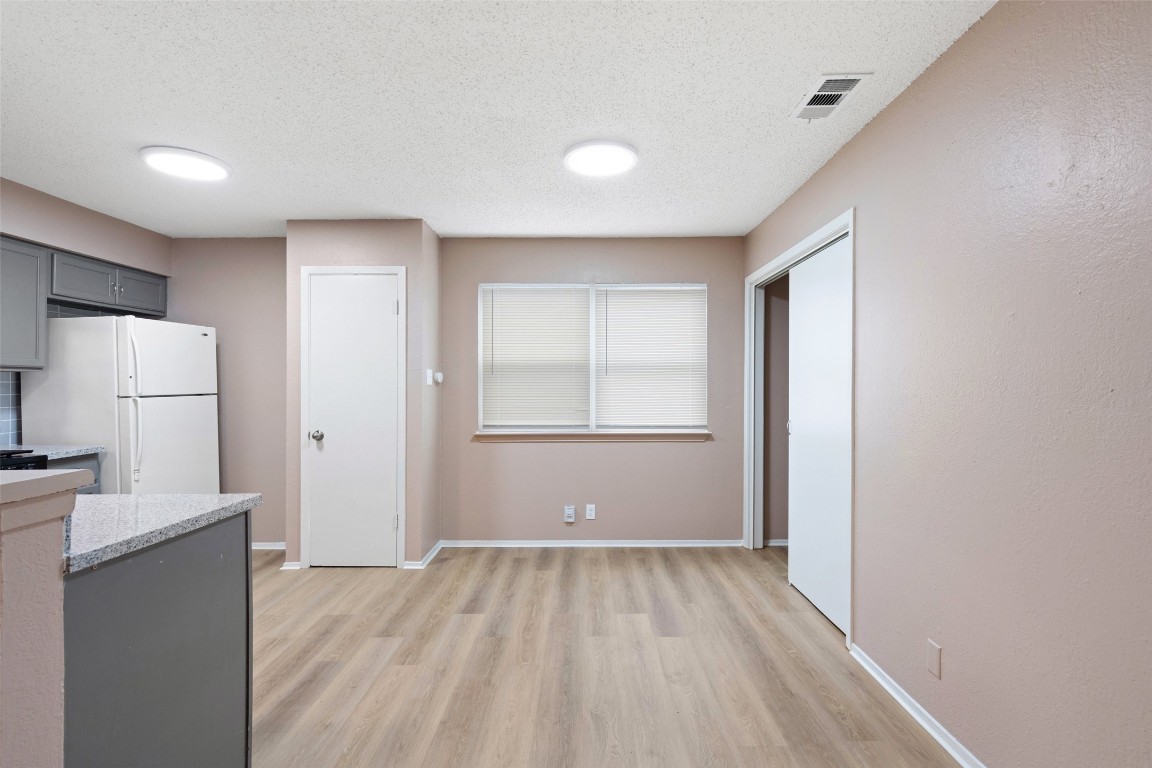 2312 Rachael Court, Unit C Austin, TX 78748 - Photo 6 of 13 a view of a room with wooden floor and electronic appliances