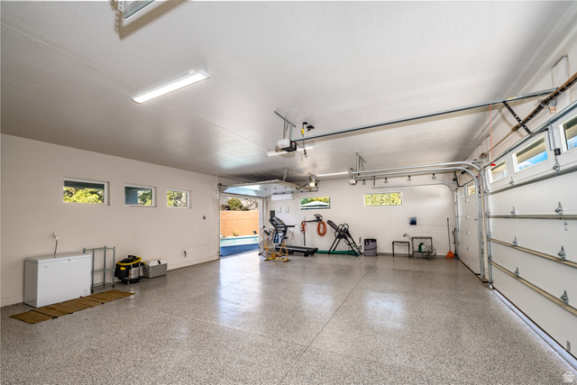 1283 North Gallen Road Santa Clara, UT 84765 - Photo 66 of 103 Garage featuring baseboards & epoxy flooring.