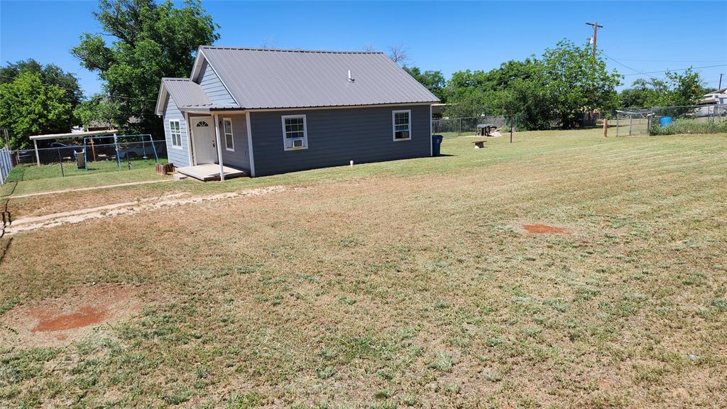 809 Bowie Street Sweetwater, TX 79556 - Photo 18 of 20 Back of property featuring metal roof