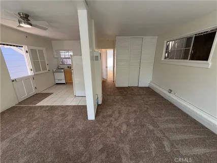 a view of empty room with windows