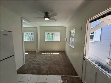 a view of an empty room with a bathroom